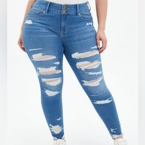 Distressed Torrid Light-Wash Jegging with White Fishnet Underlay